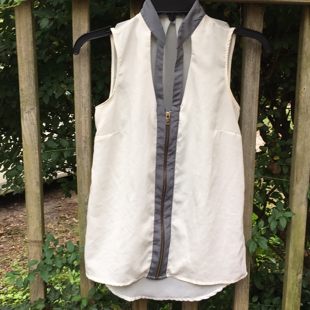 Cream sleeveless blouse